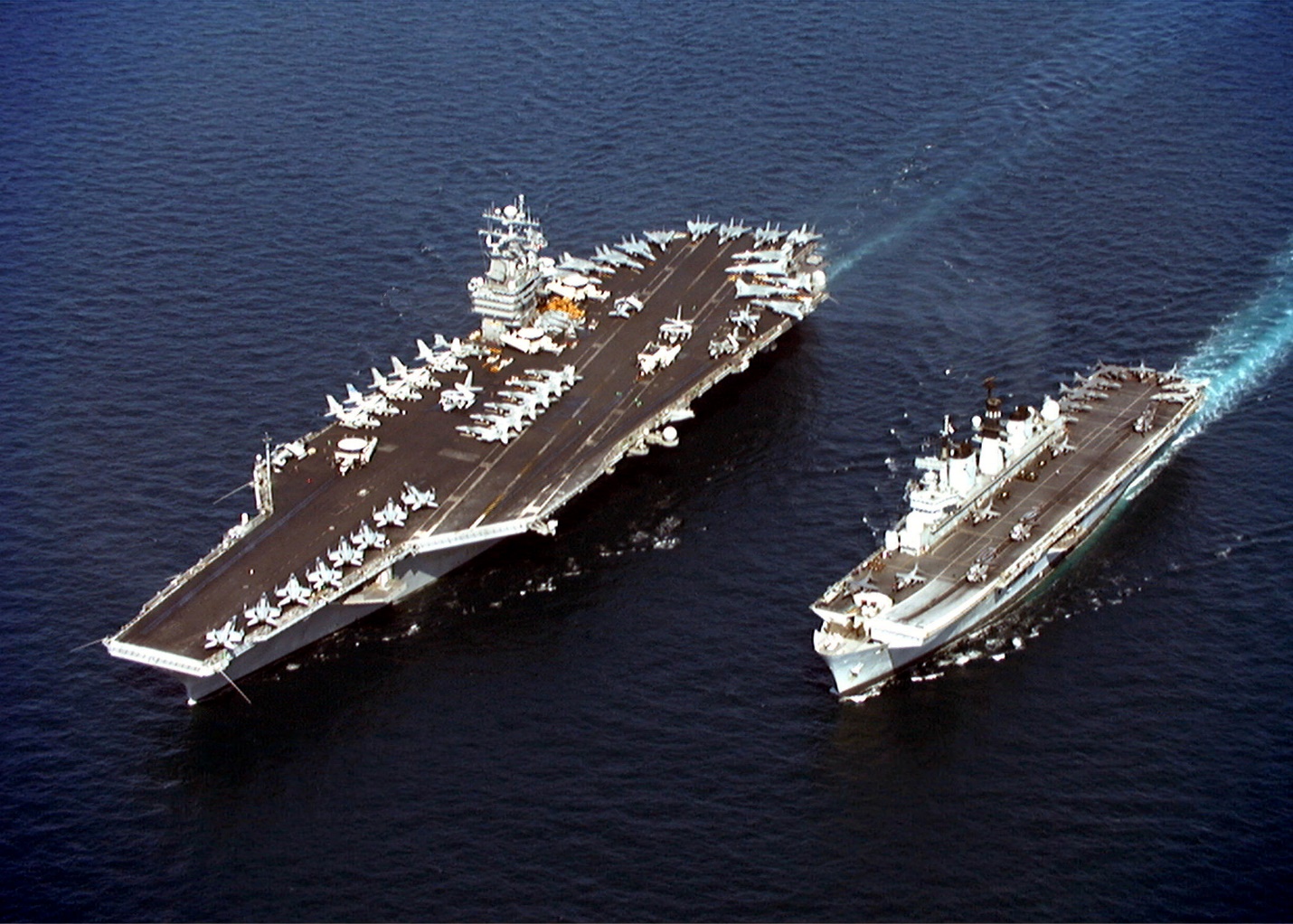 A couple of ships in the water Description automatically generated with low confidence